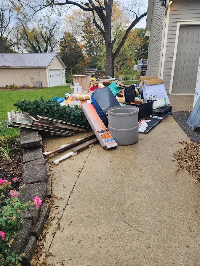 Dumpster being loaded with debris for 3 Yard Dumpster Rental in Carol Stream